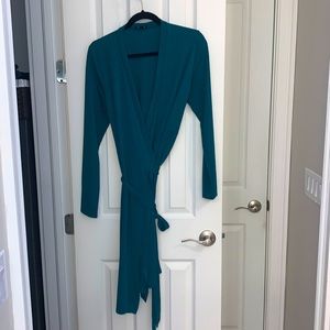 The limited teal long sleeve wrap dress in great condition. No flaws or stains.